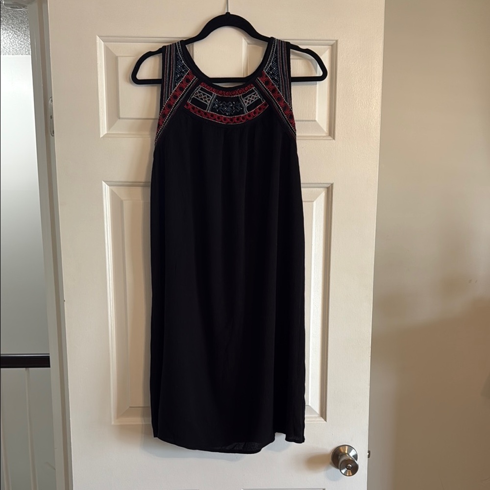 Elegant Black Sleeveless Dress with Red Accents